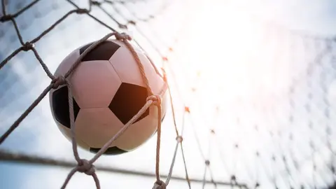 Soccer into goal success concept